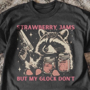 Vintage Strawberry Jams Raccoon T-Shirt | Retro Trash Panda Tee | Funny Animal Pun Shirt | Raccon Gun Meme Tee | Trendy Animal Lover Gift